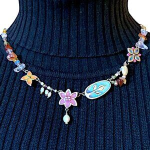 Necklace with multicolored beads and pendants.